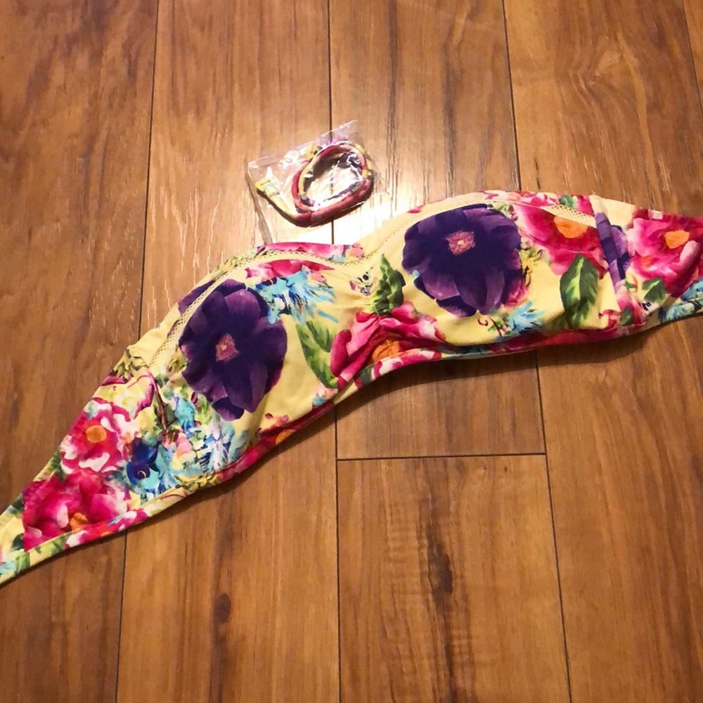 Swimsuit top. Floral. Strap included for halter.